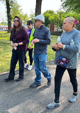 Martha Menchaca MD PhD walks with participants of Walk With a Doc