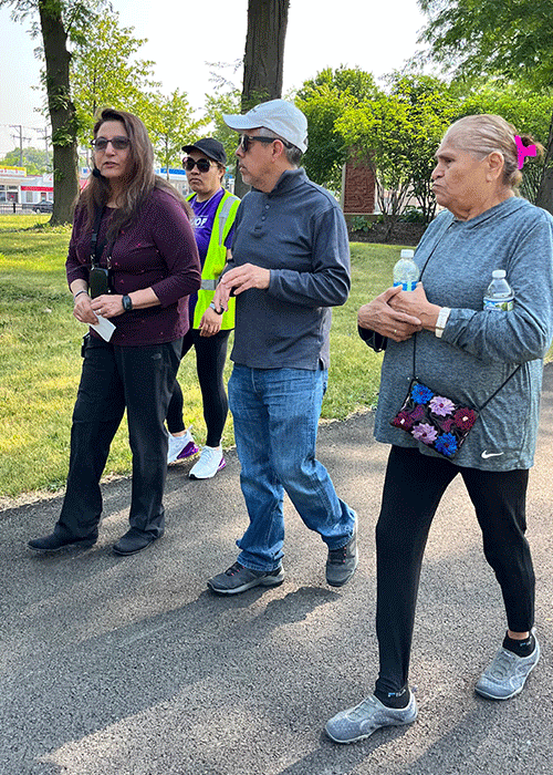 Martha Menchaca MD PhD walks with participants of Walk With a Doc