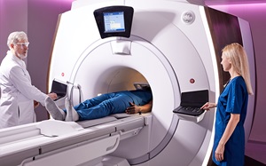 MRI procedure with patient, radiologist and technologist