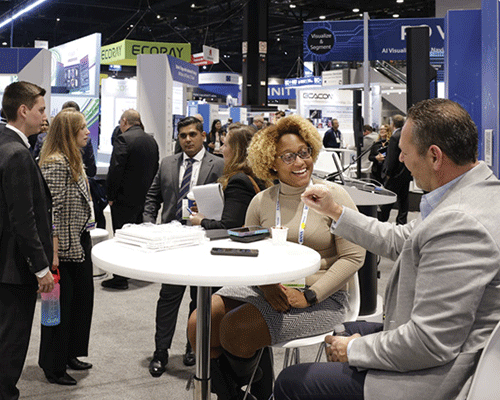 Attendees network with exhibitors