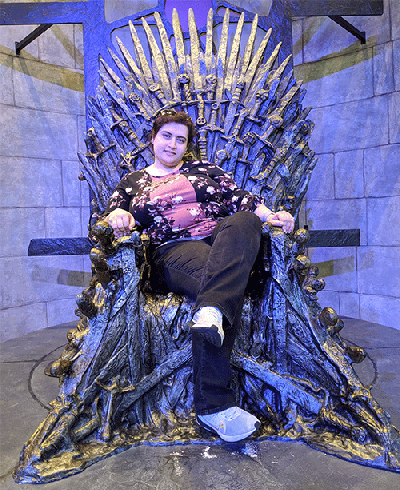 Faezeh Sodagari, MD, sitting in a large, Game of Thrones-styled throne