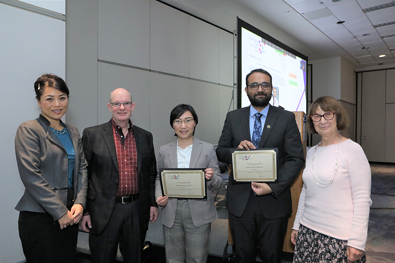 Pictured from left to right:  Drs. Caroline Chung, Timothy J. Hall, Shanshan Jiang, Ashwin Parihar, and Gudrun Zahlmann during the 2022 Quantitative Imaging Symposium: Sponsored by QIBA