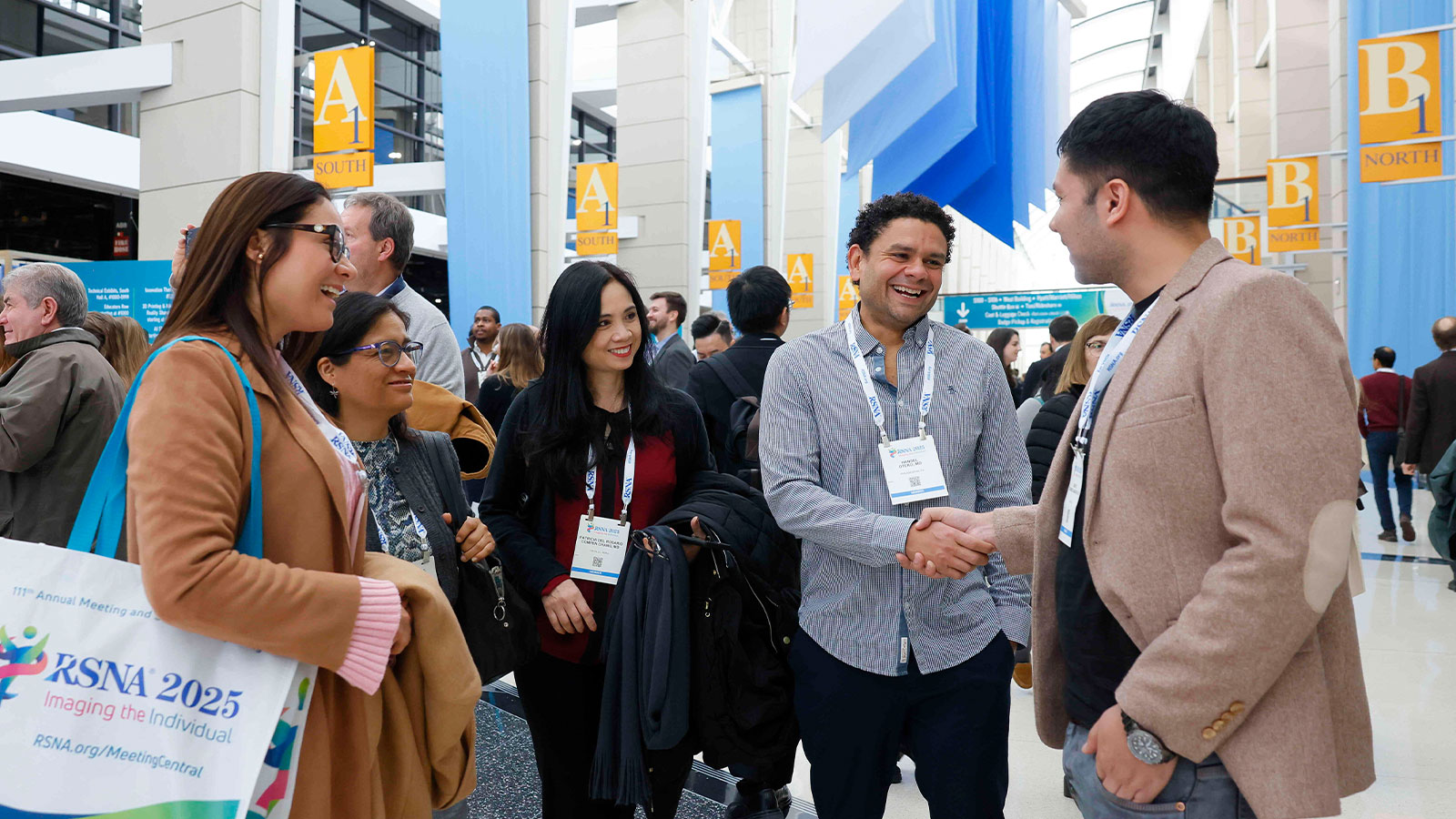 Group greeting each other at RSNA 2025