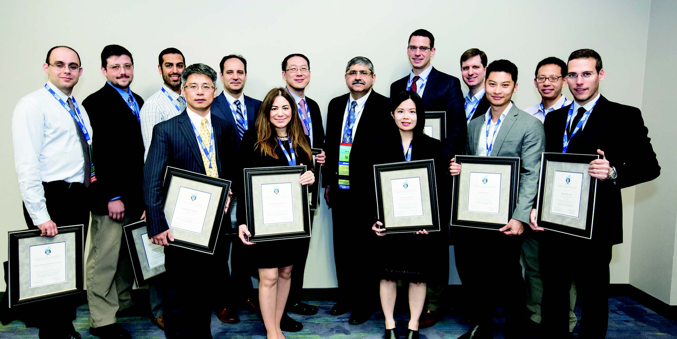 Umar Mahmood, M.D., Ph.D., (ctr) with 2015 Scholar Grant recipients at RSNA 2015. Umar Mahmood, M.D., Ph.D., (ctr) with 2015 Scholar Grant recipients at RSNA 2015.
