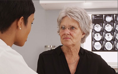 Older female patient with radiologist