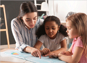 1405187411 New Africa/Shutterstock.com Daycare employee with two children