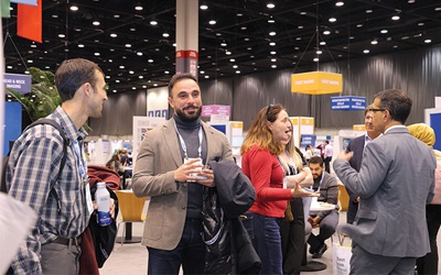 Radiology professionals gather and chat in the Learning Center during the Welcome Reception