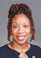 Jinel Scott, MD, smiling woman wearing a blue dress