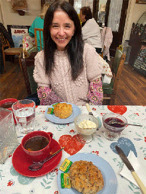 Grainne Murphy, MBCHb, BAO, MMedSc, sitting at a table with a meal in front of her
