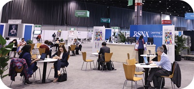 Learning Center at the RSNA annual meeting includes professionals sitting at various tables in a large conference setting