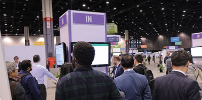 Layout of the Learning Center area at the RSNA annual meeting including people viewing on-screen presentations