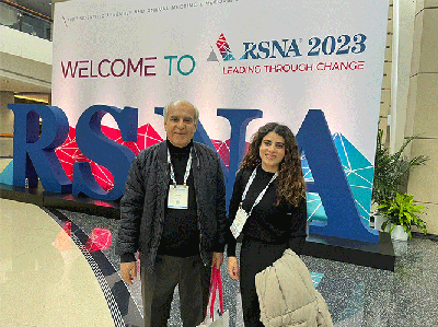 Dana Alkhulaifat, MD, stands with her father Samih Alkhulaifat, MD