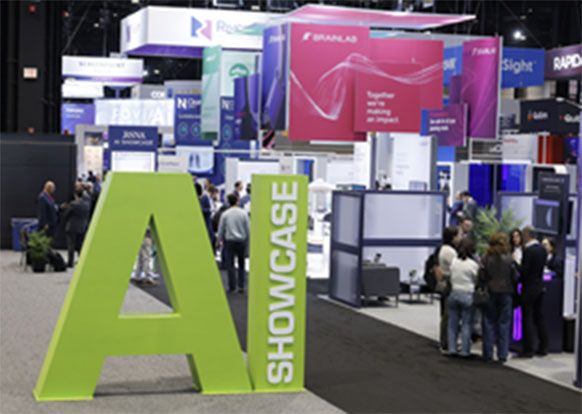 Large green AI letters at the entrance of the AI Showcase at the RSNA annual meeting. 