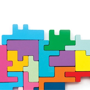 Brightly colored puzzle pieces put together in an organized and orderly way