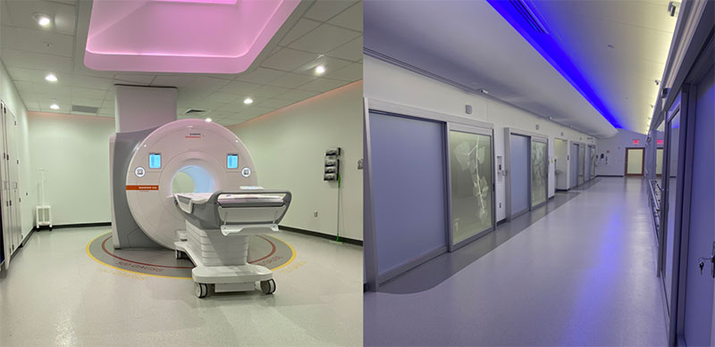 Image of an MRI machine in a room on the left and a hallway with multiple doorways on the right depicting an MRI suite.