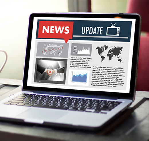 Open laptop with a news site on the screen. 