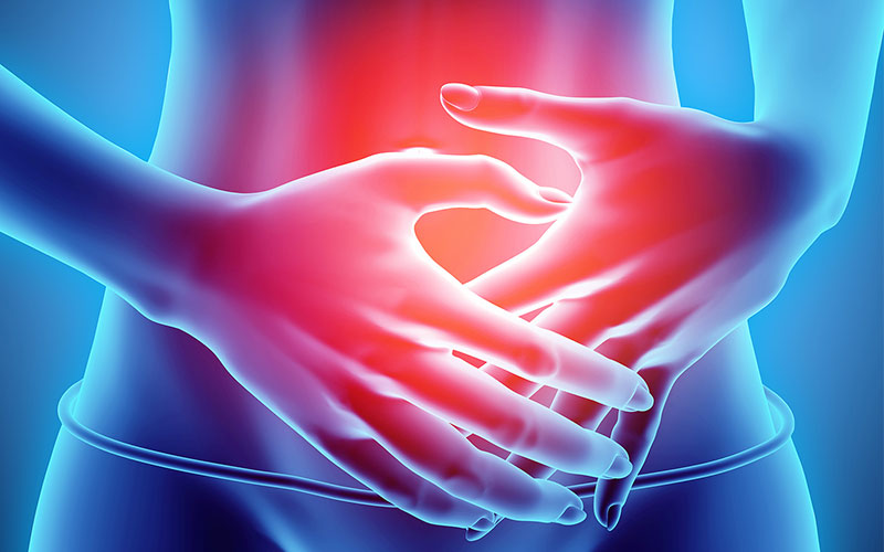 Graphic depiction of the abdominal section of a woman with her hands positioned on her abdomen and red coloring depicting radiating pain.