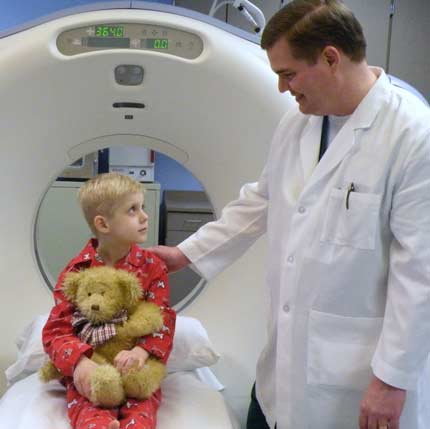 Pediatric CT Photo of a child being prepared for a CT scan.