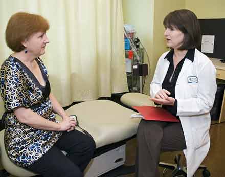 Breast MRI Photo of a radiologist explaining breast MRI to patient.